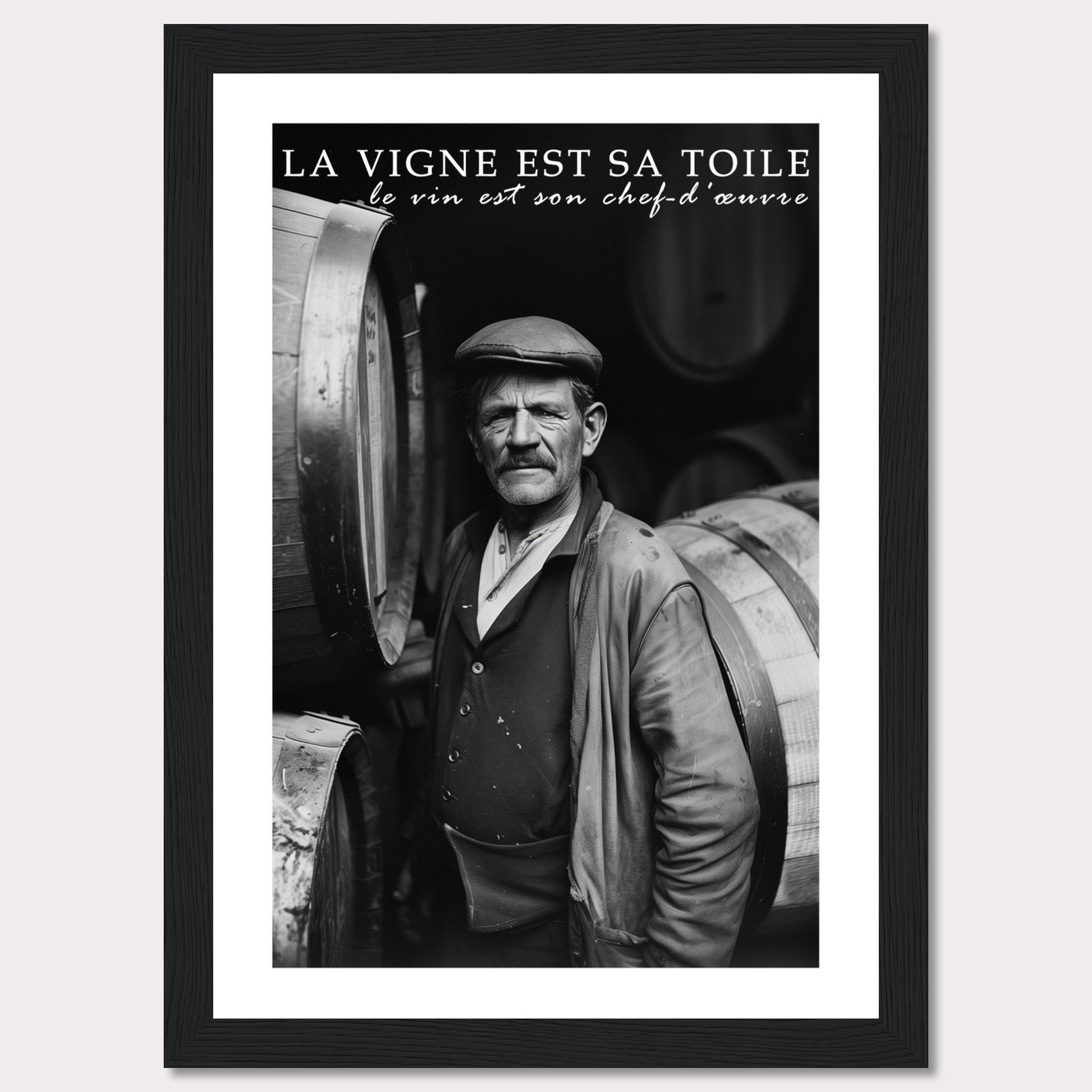 This striking black-and-white photograph captures a seasoned winemaker standing proudly among wine barrels. The text above reads, "La vigne est sa toile, le vin est son chef-d'œuvre," which translates to "The vineyard is his canvas, the wine is his masterpiece." The image exudes a sense of dedication and craftsmanship.