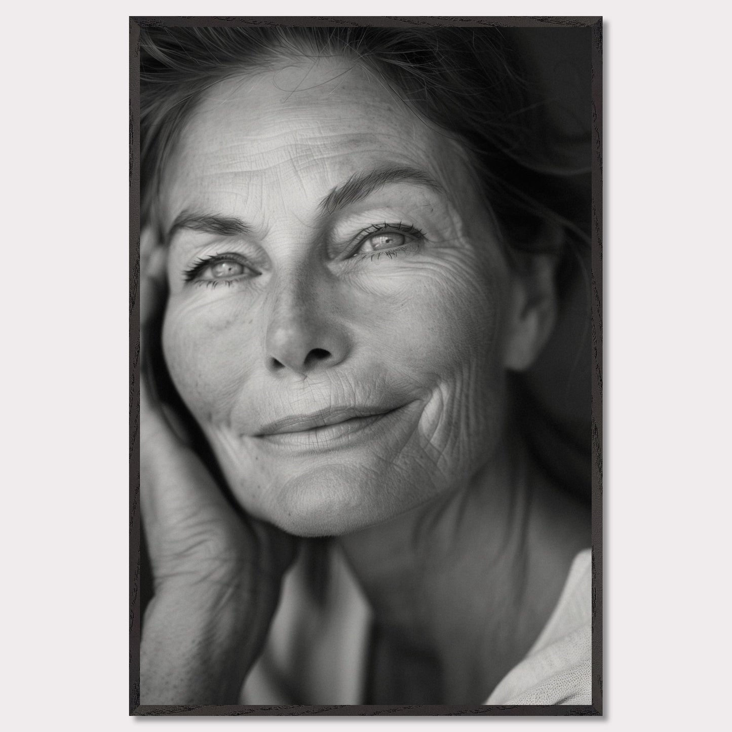 This captivating black-and-white portrait captures the serene and wise expression of an elderly woman. Her gentle smile and thoughtful gaze evoke a sense of peace and contentment. The fine lines on her face tell a story of a life well-lived, filled with experiences and wisdom.