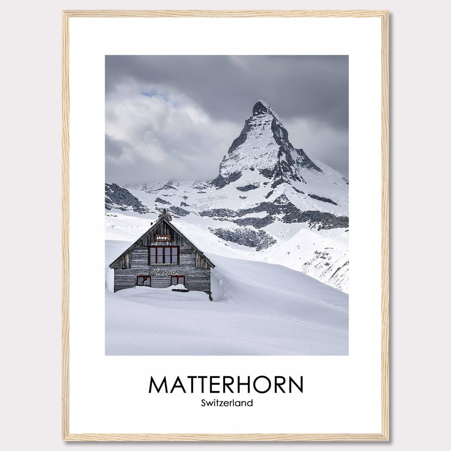 This stunning photograph captures the iconic Matterhorn in Switzerland, with a charming wooden cabin nestled in the snow-covered landscape. The majestic peak rises dramatically against a cloudy sky, creating a breathtaking scene of natural beauty.