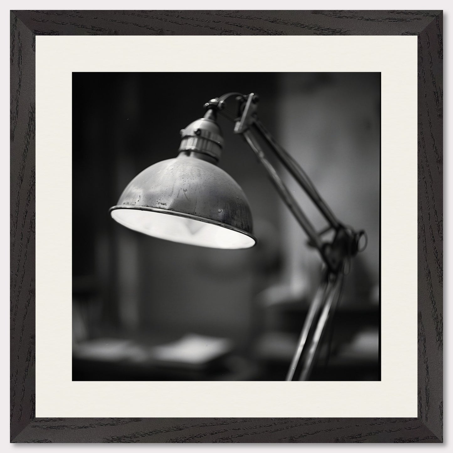 This illustration shows a black and white image of a vintage desk lamp with a metal shade.