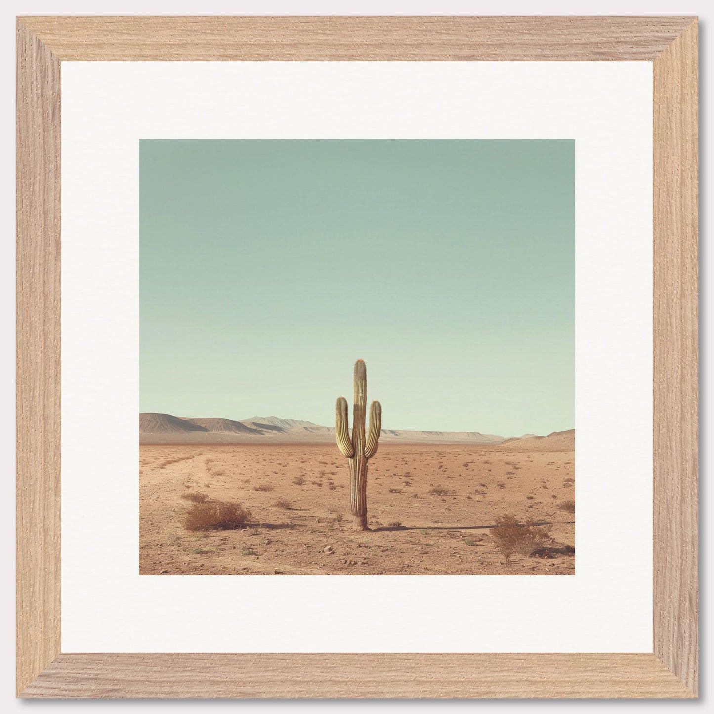 This serene photograph captures the solitary beauty of a lone cactus standing tall in a vast desert landscape. The clear blue sky stretches endlessly above, while distant mountains create a tranquil backdrop. The image is framed in a simple, elegant black border, enhancing its minimalist appeal.