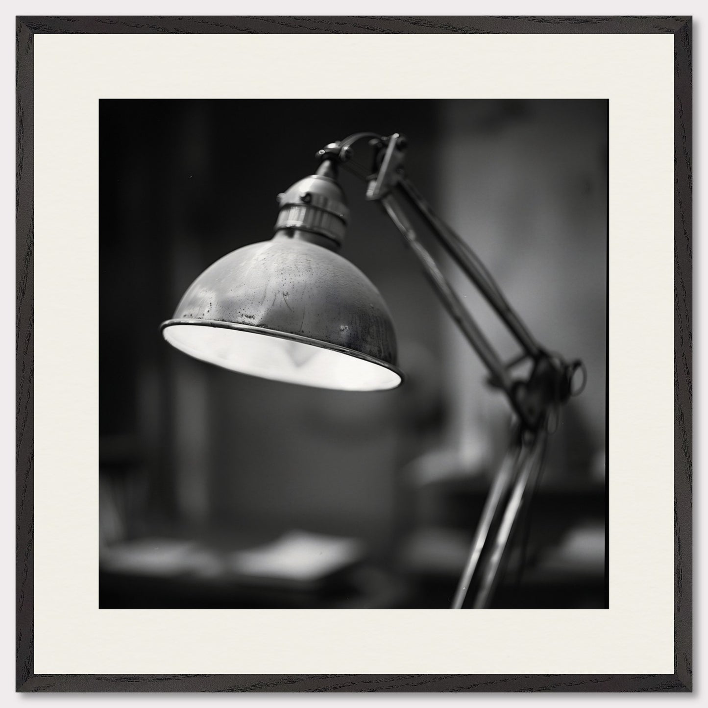 This illustration shows a black and white image of a vintage desk lamp with a metal shade.