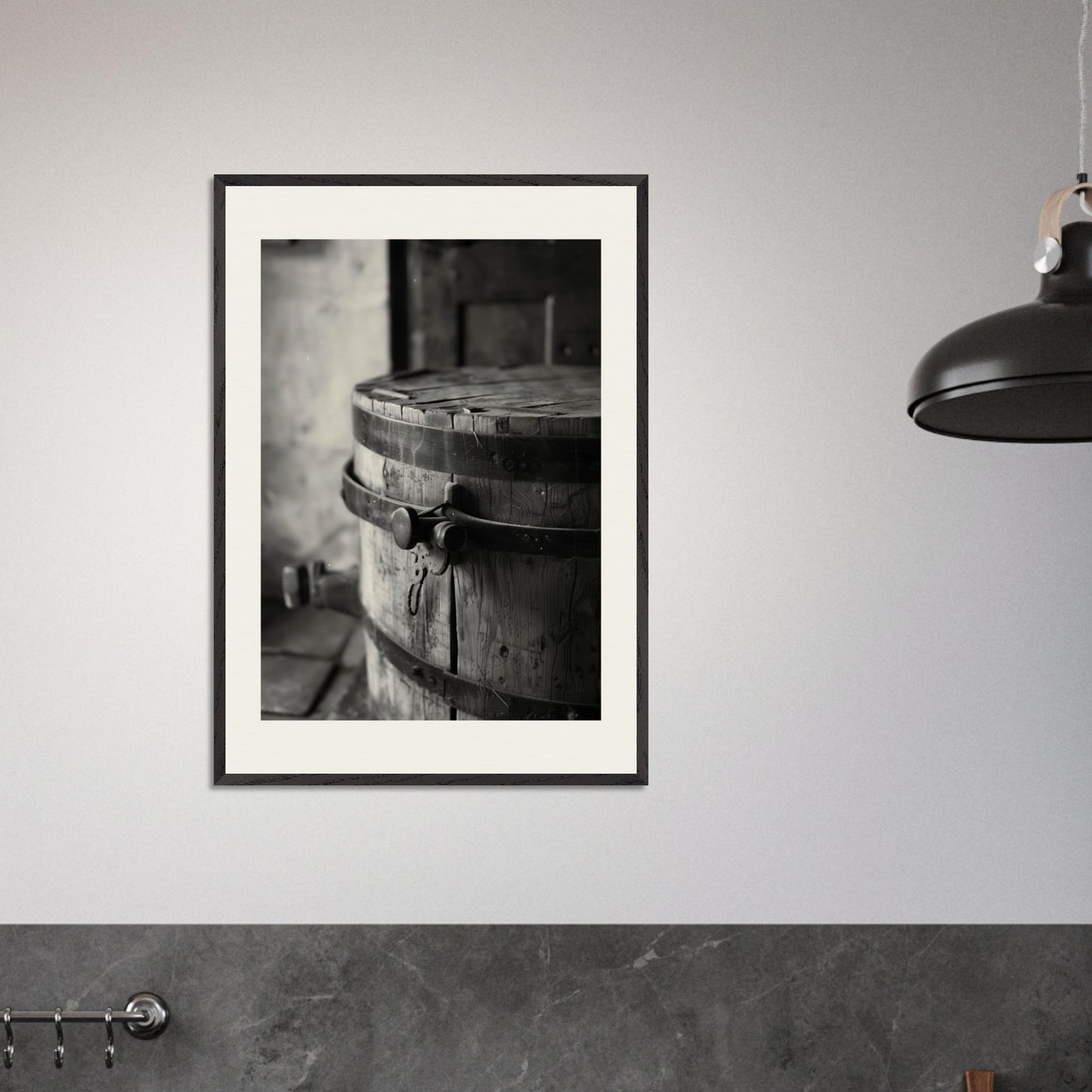 This black and white illustration depicts an old wooden barrel with metal bands, placed in a rustic setting.