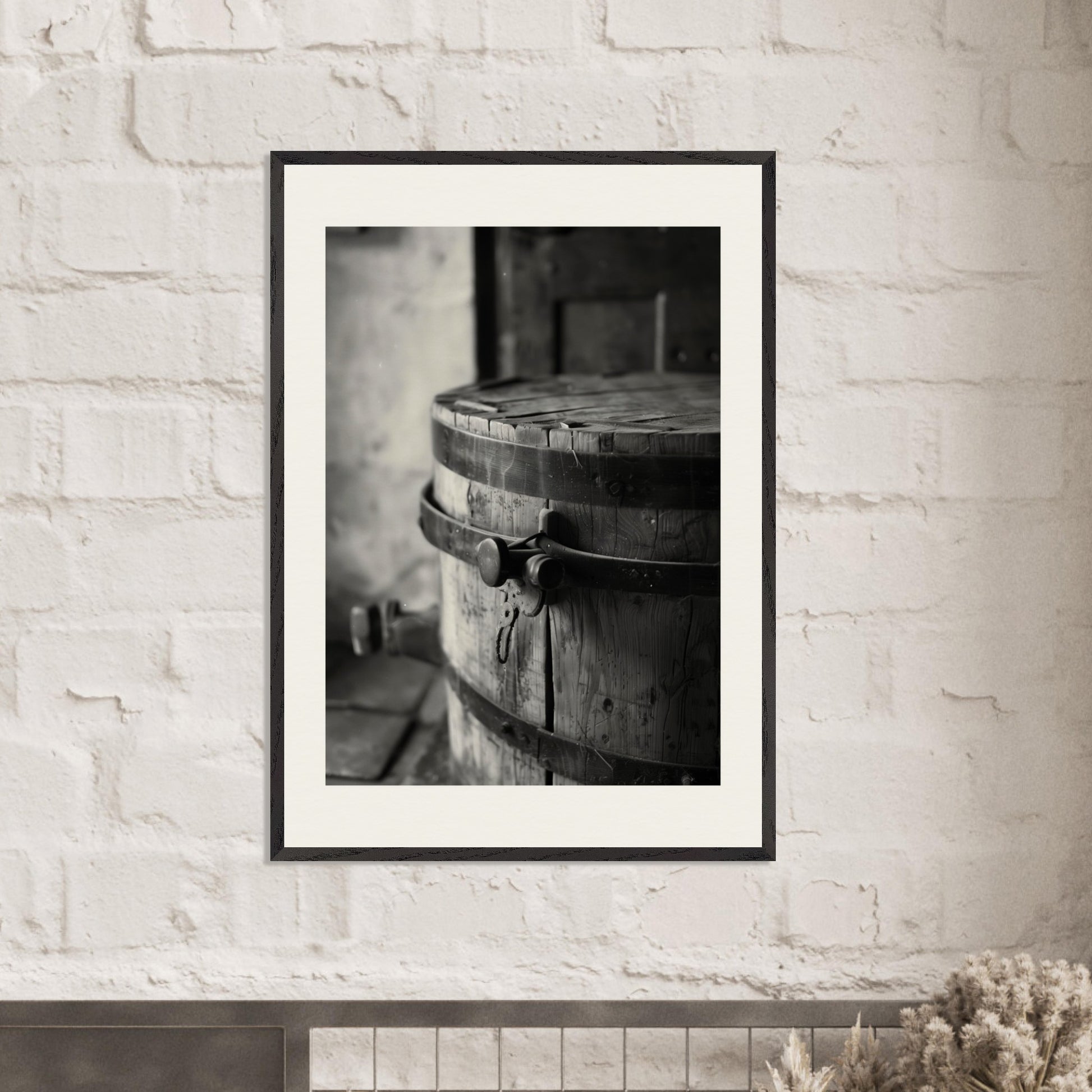 This black and white illustration depicts an old wooden barrel with metal bands, placed in a rustic setting.