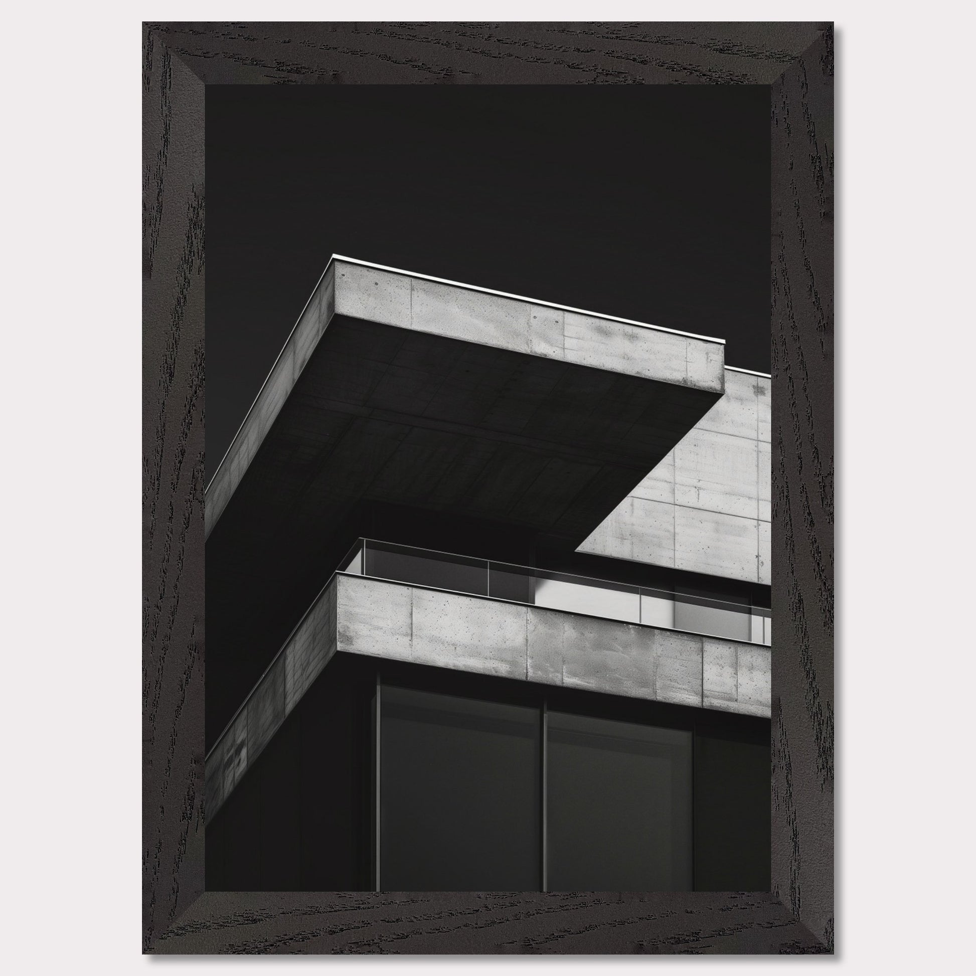 This striking black and white photograph captures the modern architectural lines of a concrete building against a dark background. The image highlights the stark contrast and geometric precision of contemporary design.