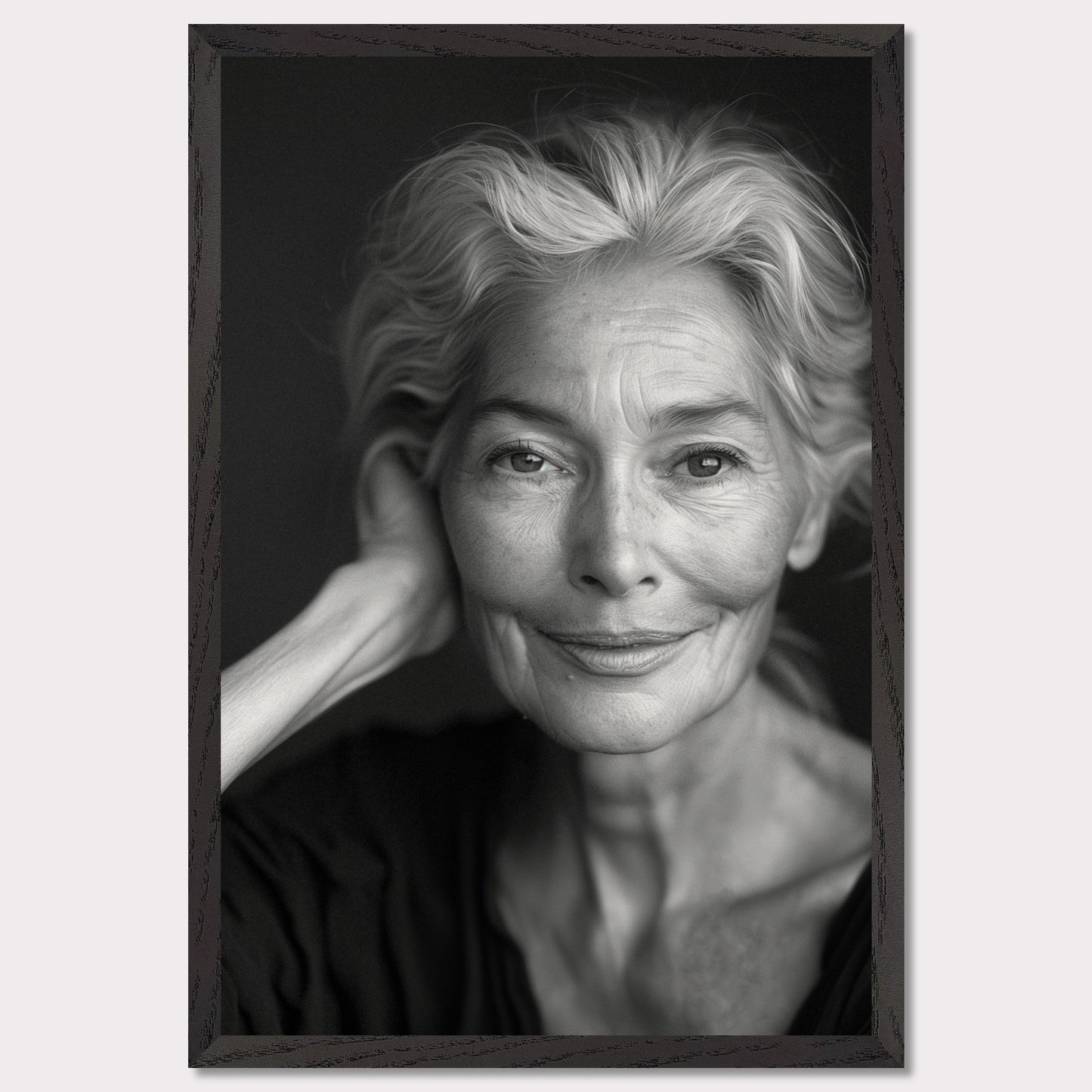 This black and white portrait captures the serene expression of an elderly woman. Her gentle smile and relaxed pose exude wisdom and tranquility, while the fine lines on her face tell a story of a life well-lived.