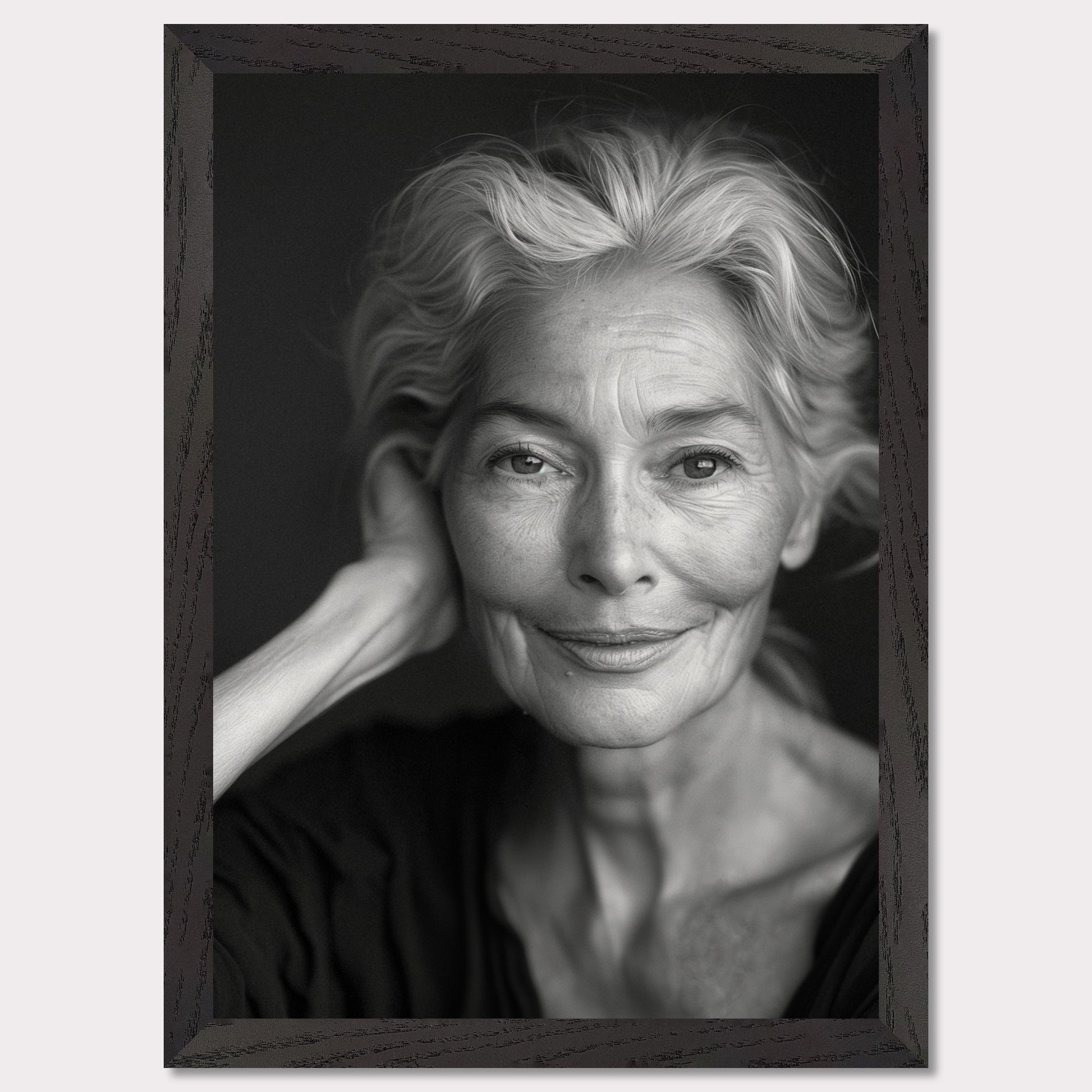 This black and white portrait captures the serene expression of an elderly woman. Her gentle smile and relaxed pose exude wisdom and tranquility, while the fine lines on her face tell a story of a life well-lived.