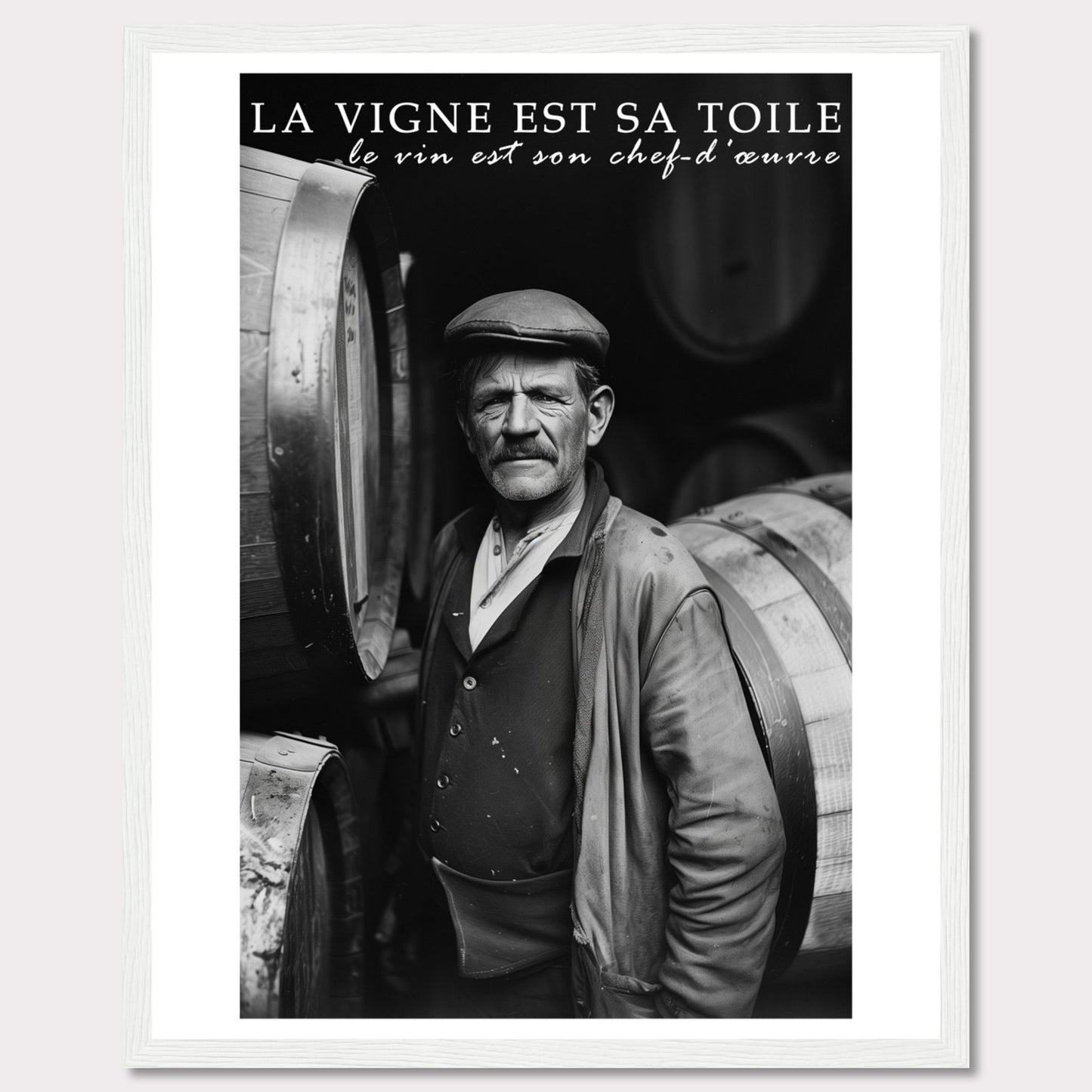 This striking black-and-white photograph captures a seasoned winemaker standing proudly among wine barrels. The text above reads, "La vigne est sa toile, le vin est son chef-d'œuvre," which translates to "The vineyard is his canvas, the wine is his masterpiece." The image exudes a sense of dedication and craftsmanship.