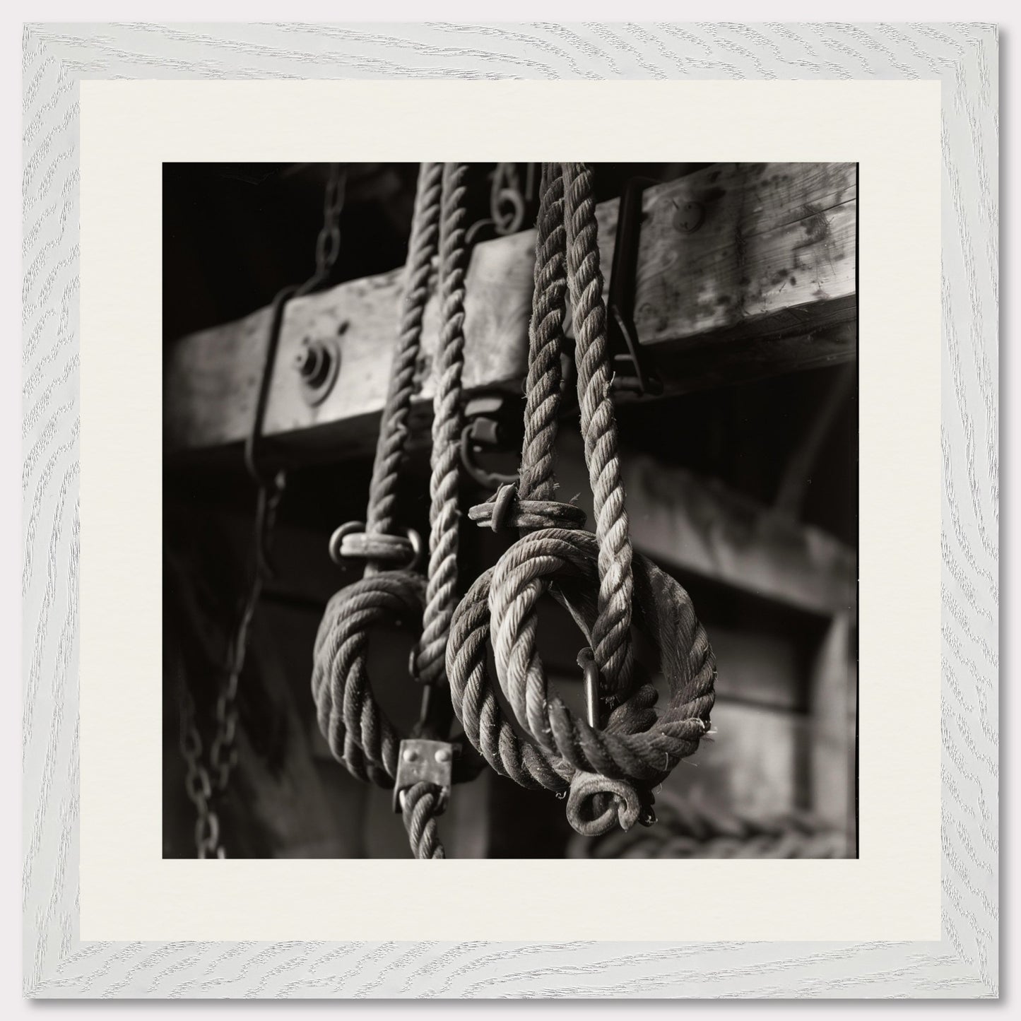 This black and white illustration depicts a close-up view of coiled ropes hanging from wooden beams, evoking a rustic or nautical theme.